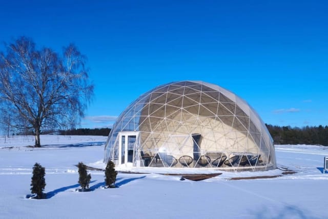Geodesic dome on the snow under a clear winter sky